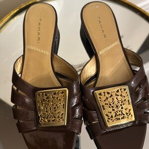 TAHARI sandals, brown patent leather, gold soles and fleur-de-lid embellishment